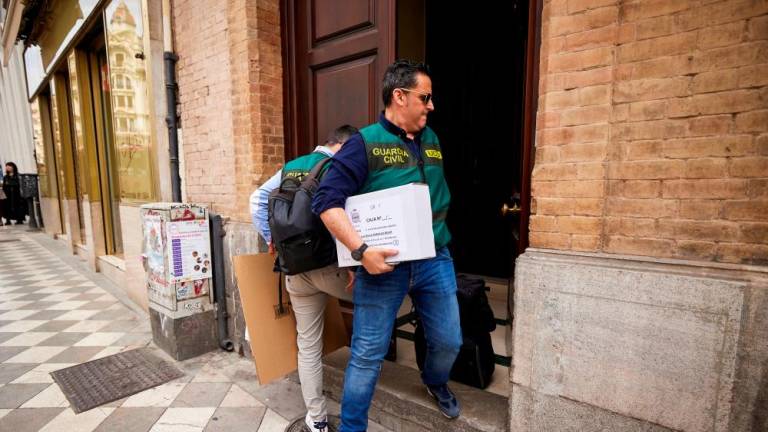 Spanish Civil Guard officers carry a box and bags after completing a search to the home of former Spanish Football Federation chief Luis Rubiales, in Granada, Spain, March 20, 2024/REUTERSpix