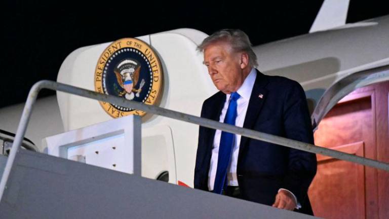 US President Donald Trump disembarks from Air Force One upon arrival at Palm Beach International Airport in West Palm Beach, Florida, May 1, 2025, as he travels to spend the weekend in Florida. AFPpix