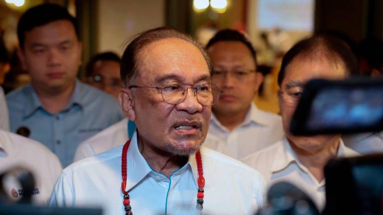 Perdana Menteri Datuk Seri Anwar Ibrahim pada sidang media selepas Perjumpaan bersama Majlis Pimpinan Negeri (MPN) Keadilan Sarawak di sebuah Hotel hari ini -fotoBERNAMA