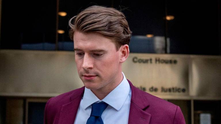 Carter Hart leaves court after a judge found him and his teammates not guilty in the trial involving players from Canada’s 2018 gold medal–winning world junior hockey team, who were charged with sexually assaulting a woman in a hotel room, at the Superior Court of Justice in London, Ontario, Canada, July 24, 2025- REUTERS/Carlos Osorio TPX IMAGES OF THE DAY