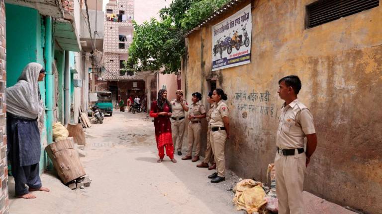 Police officers stand in an alley dominated by Muslim families in Badshahpur in Gurugram, India, August 8, 2023. - REUTERSPIX