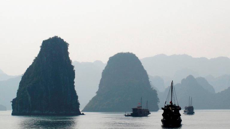 Tourist boats cruise in Halong Bay in this photo on January 11, 2009 REUTERS file pic