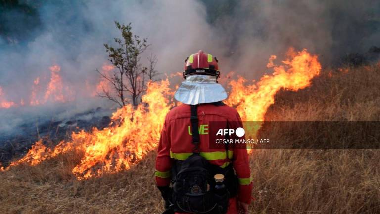 A member of Spain's Military Emergency Unit (UME) tackles a wildfire in Garano, northwestern Spain, on August 25, 2025. - AFP