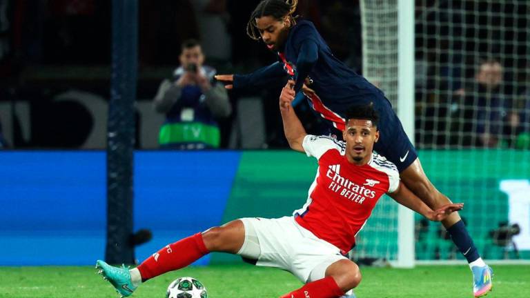 Arsenal’s French defender #02 William Saliba (R) fights for the ball with Paris Saint-Germain’s French forward #29 Bradley Barcola (L) during the UEFA Champions League semi-final second leg football match between Paris Saint-Germain (PSG) and Arsenal at the Parc des Princes stadium in Paris, on May 7, 2025. AFPix