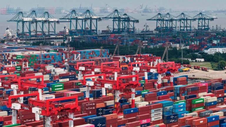 Shipping containers are stacked at a port in Shanghai on June 9, 2025. Chinese exports grew slower than expected in May, according to official data on June 9, as shipments to the United States tumbled amid global trade turmoil triggered by Donald Trump’s tariff blitz.. AFPpix