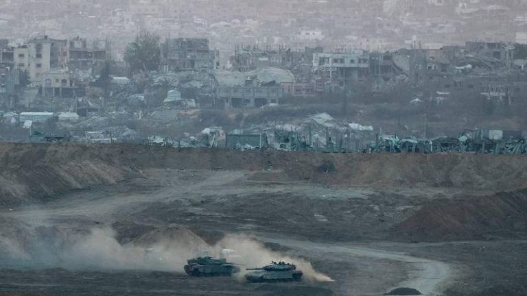 Israeli tanks operate in Gaza, by the Israel-Gaza border, as seen from Israel, May 3, 2025. REUTERS/Amir Cohen
