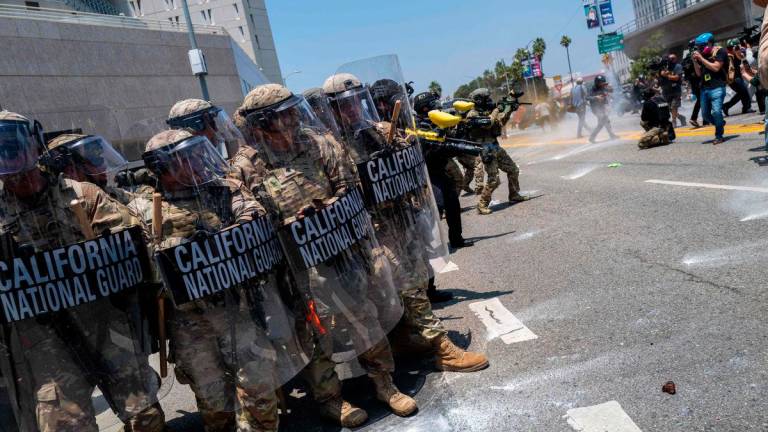 The National Guard, police and protesters stand off outside of a downtown jail in Los Angeles following two days of clashes with police during a series of immigration raids on June 08, 2025 in Los Angeles, California. Photo by SPENCER PLATT / GETTY IMAGES NORTH AMERICA / AFP