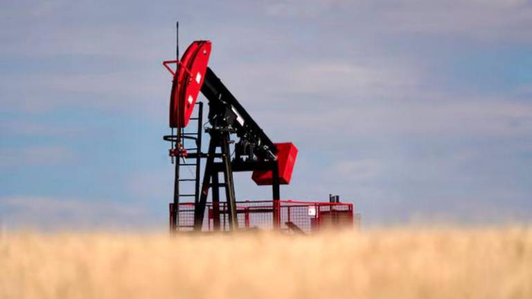 A view of an oil pumpjack in a farmer’s field near Kindersley, Saskatchewan, Canada - REUTERSpix