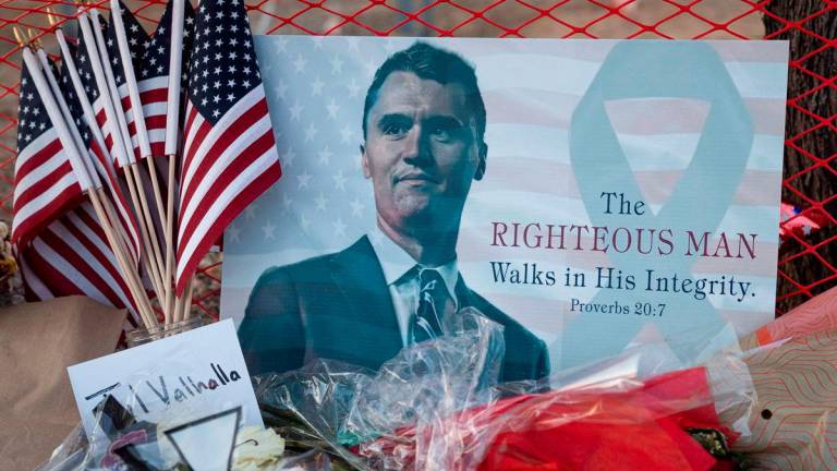 A poster of conservative activist Charlie Kirk is displayed at a memorial following the fatal shooting of Kirk, at the Turning Point USA headquarters in Phoenix, Arizona, U.S., September 12, 2025. REUTERS/Thomas Machowicz