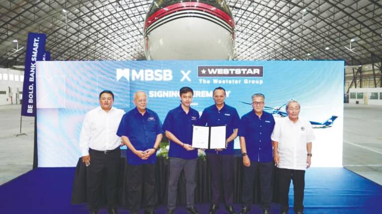 From left: National Aerospace Defence Industries Sdn Bhd (Nadi) president Datuk Edron Hayata Ahmad, Syed Azman, Weststar Group director Syed Muhammad Azni Syed Azman, MBSB Group CEO Rafe Haneef, Wan Kamaruzaman and Nadi Group chairman Tan Sri Ahmad Johan at the MBSB-Weststar MoU signing ceremony.