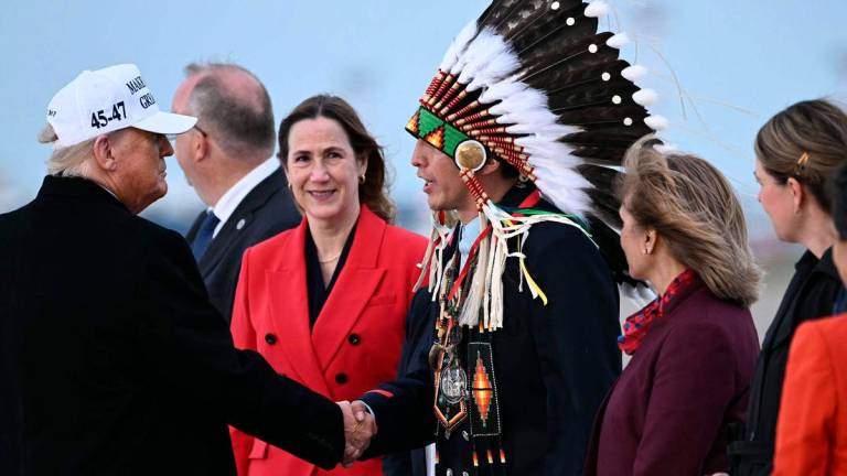 US President Donald Trump (L) is greeted by Steven Crowchild of the Tsuut’ina First Nation (3R) upon arrival at Calgary International Airport, before the start of the G7 summit, in Calgary, Alberta, Canada, June 15, 2025. AFPpix