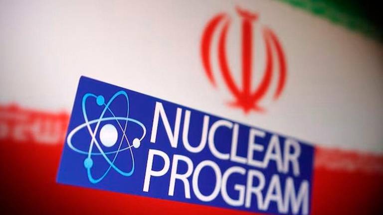 Iranian flag, atom symbol and words “Nuclear program” are in this illustration taken June 16, 2025. - REUTERS
