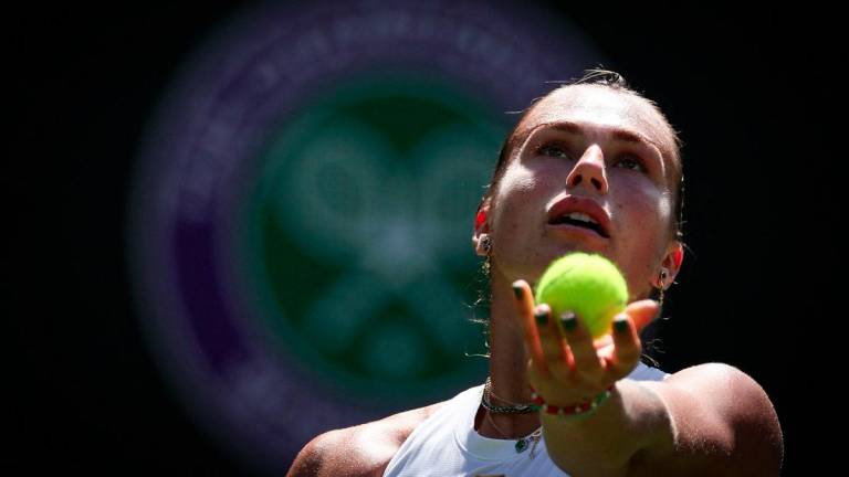 Belarus's Aryna Sabalenka serves to US-Canada's Carson Branstine during their women's singles first round tennis match on the first day of the 2025 Wimbledon Championships at The All England Lawn Tennis and Croquet Club in Wimbledon, southwest London, on June 30, 2025. - AFPPIX