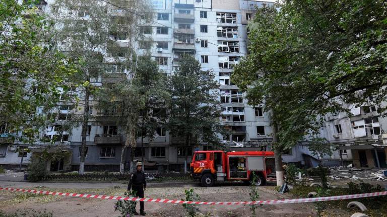 Firefighters work at the site of apartment buildings hit during a Russian missile strike, amid Russia’s attack on Ukraine, in Dnipro, Ukraine September 20, 2025. REUTERS/Mykola Synelnykov