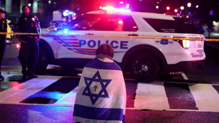 Emergency personnel work at the site where, according to the U.S. Homeland Security Secretary, two Israeli embassy staff were shot dead near the Capital Jewish Museum in Washington, D.C., U.S. May 21, 2025.REUTERSpix