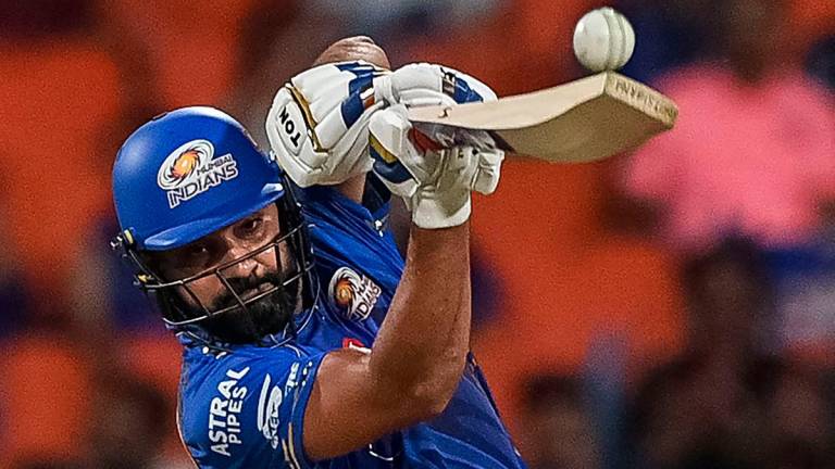 Mumbai Indians’ Rohit Sharma plays a shot during the Indian Premier League (IPL) Twenty20 Eliminator cricket match between Gujarat Titans and Mumbai Indians at the Maharaja Yadavindra Singh International Cricket Stadium on the outskirts of Chandigarh on May 30,