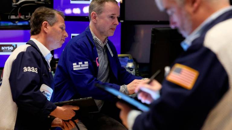 Traders working on the floor at the New York Stock Exchange on Tuesday. – Reuterspic