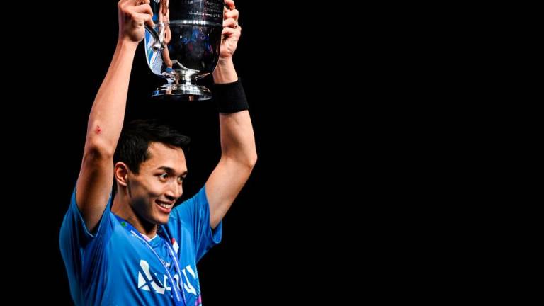 Gold medallist Indonesia’s Jonatan Christie celebrates after winning the Men’s Singles Final at the All England Open Badminton Championships at the Utilita Arena in Birmingham, central England, on March 17, 2024/AFPPix