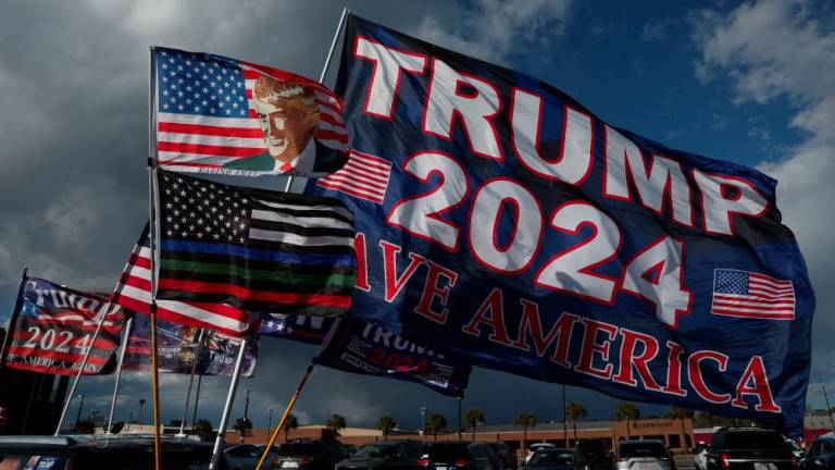 Flags in support of former U.S. President and Republican presidential candidate Donald Trump are pictured outside the venue of his South Carolina Republican presidential primary election night party, in Columbia, South Carolina, U.S. February 24, 2024. - REUTERSPIX