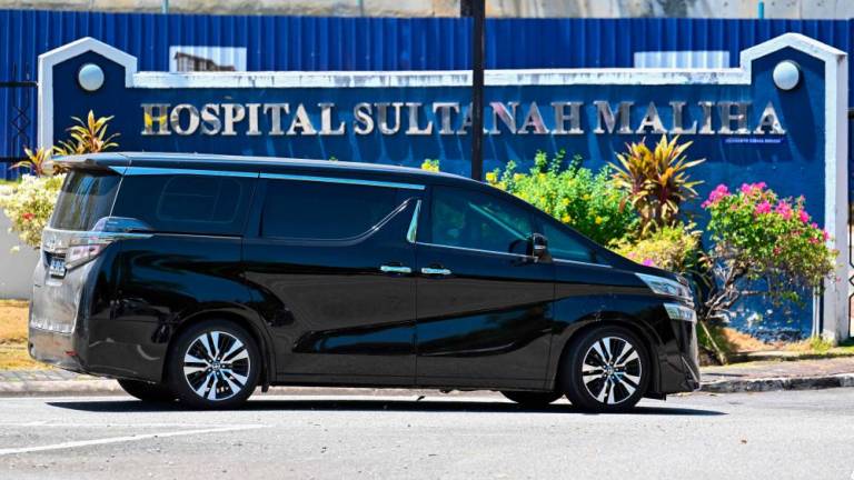A vehicle with a diplomatic license plate enters Sultanah Maliha Hospital, where Norway’s King Harald has been admitted with an infection, on the Malaysian resort island of Langkawi on February 29, 2024/AFPPix