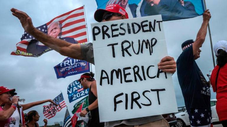 Supporters of former US President and Republican presidential candidate Donald Trump show their support on Election Day - REUTERSpix