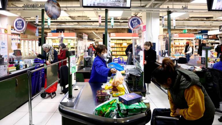 A cashier scanning products at the checkout of a Carrefour hypermarket in Paris. – Reuterspic