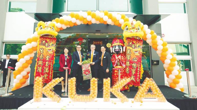 (From left) Puchong MP Yeo Bee Yin, Midea Group vice president Andy Gu, Kuka Robotics HQ chief sales officer Erich Schober and Fam launching the Kuka Malaysia office. – PICS COURTESY OF KUKA