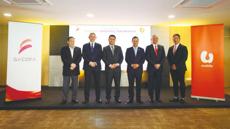 From left: Mat Hassan, Sulaiman, Julaihi, Liwan, Wong and U Mobile chief technology officer Woon Ooi Yuen.