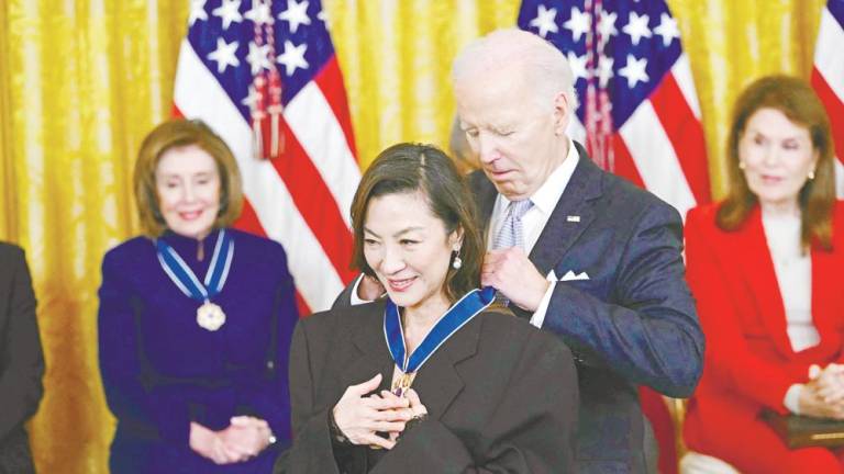Biden presents the Presidential Medal of Freedom to Yeoh in the East Room of the White House in Washington, DC last Friday. – AFPPIC