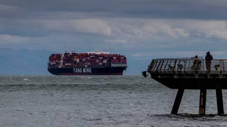 A cargo ship full of containers is seen at the port of Oakland as trade tensions escalate over U.S. tariffs, in Oakland, California - REUTERSpix