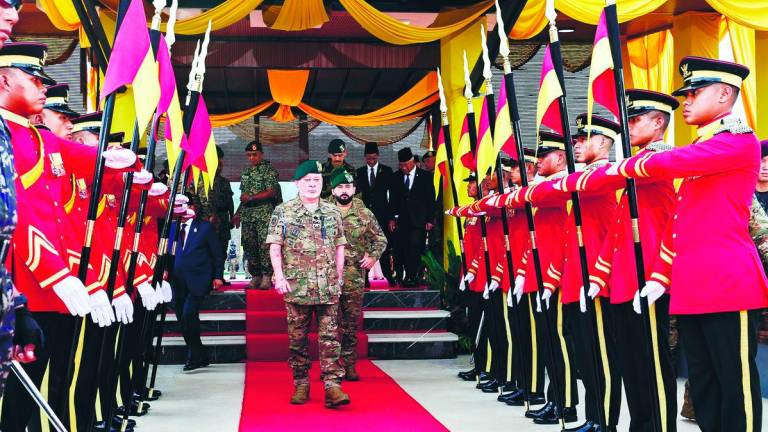 The King and the Regent of Johor Tunku Mahkota Ismail leaving after attending the parade at Kem Iskandar in Mersing yesterday. – BERNAMApix