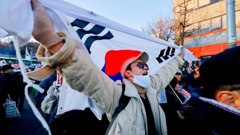 Demonstrators opposing the court’s approval of an arrest warrant for impeached South Korean President Yoon Suk Yeol protest outside his official residence in Seoul - REUTERSpix