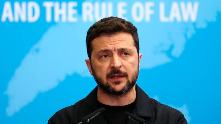 Ukraine’s President Volodymyr Zelensky speaks after the signing of an agreement for establishing a special tribunal to try top officials responsible for Russia’s invasion of Ukraine at the Council of Europe in Strasbourg, eastern France, on June 25, 2025. (Photo by FREDERICK FLORIN / AFP)
