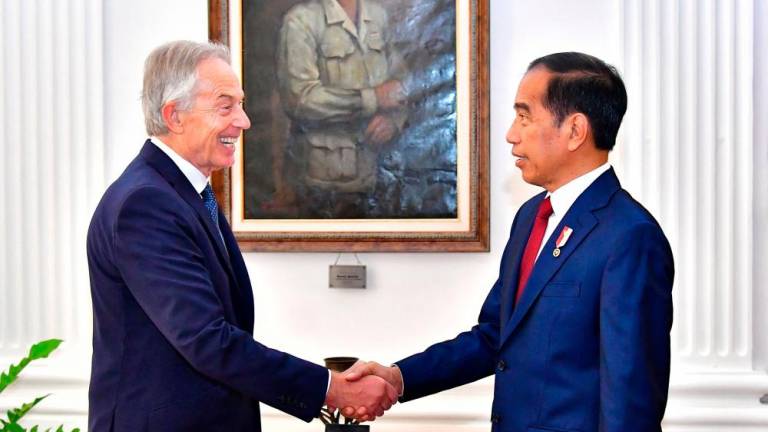 This handout picture taken and released on April 18, 2024 by Indonesia’s presidential palace shows Indonesian President Joko Widodo (R) meeting with former British Prime Minister Tony Blair at the Merdeka Palace in Jakarta/AFPPix