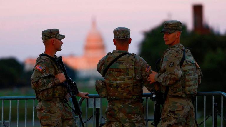 Members of the National Guard carry firearms while patrolling the National Mall, weeks after U.S. President Donald Trump ordered the National Guard and law enforcement to patrol the nation's capital to assist in crime prevention, in Washington, D.C., U.S., August 26, 2025. - REUTERSPIX