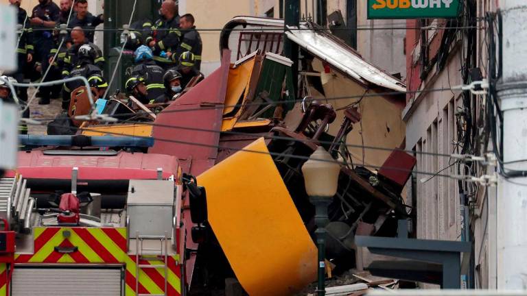 Police and firefighters work on the site of a funicular railway accident in Lisbon, on September 3, 2025. - AFPPIX