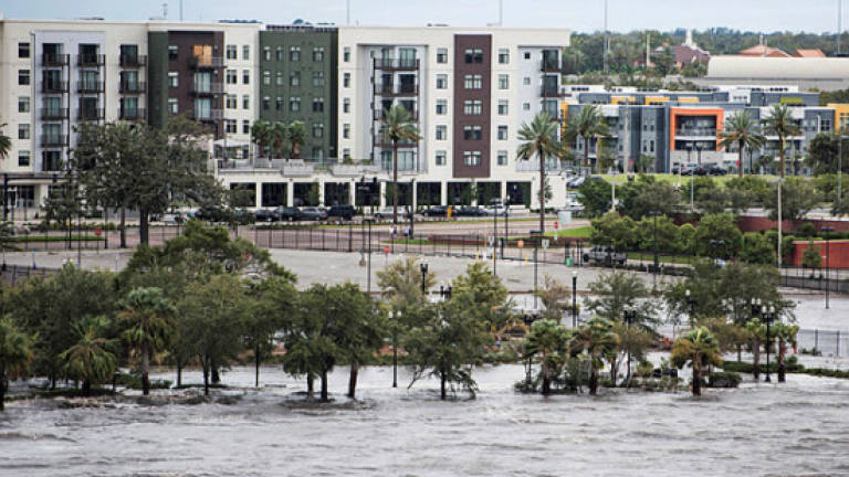 Irma weakens but flooding in Jacksonville, damage to Keys