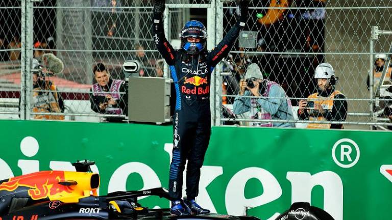 Formula One F1 - Las Vegas Grand Prix - Las Vegas Strip Circuit, Las Vegas, Nevada, United States - November 23, 2024 Red Bull’s Max Verstappen celebrates after winning the 2024 F1 world championship title. - REUTERS/Mike Blake