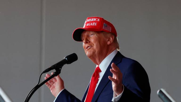 Republican presidential nominee and former U.S. President Donald Trump gestures as he speaks during a rally in Juneau - REUTERSpix