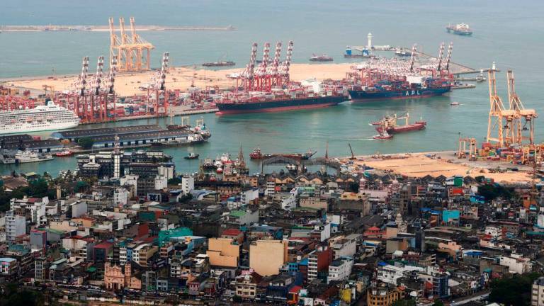A general view of the Colombo main port is seen beyond the main wholesale market in Colombo, Sri Lanka November 12, 2023.Picture taken November 12, 2023. REUTERSpix