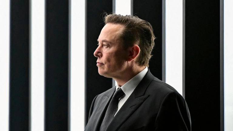 FILE PHOTO: Elon Musk attends the opening ceremony of the new Tesla Gigafactory for electric cars in Gruenheide, Germany, March 22, 2022. Patrick Pleul/Pool via REUTERS/File Photo