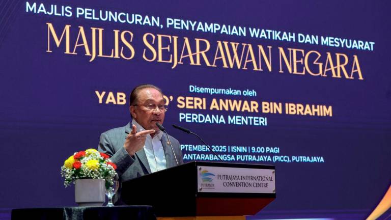 Prime Minister Datuk Seri Anwar Ibrahim delivers a speech at the Launch Ceremony, Presentation of Appointment Letters, and Meeting of the National Historians Council at the Putrajaya International Convention Centre (PICC) today. – BERNAMA