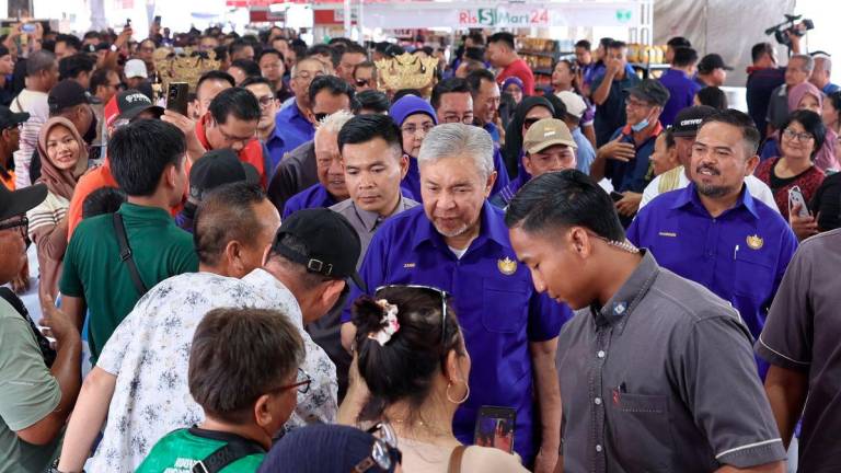 Deputy Prime Minister Datuk Seri Dr Ahmad Zahid Hamidi greeted and engaged with guests attending the official launch of the RISDA MADANI Carnival (KARRISMA) Sabah 2025 at Padang Kota Belud today. – BERNAMA