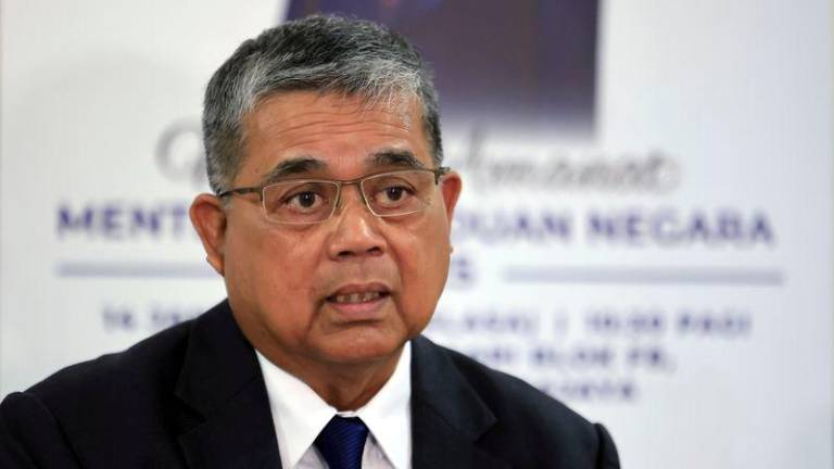 Menteri Perpaduan Negara Datuk Aaron Ago Dagang bercakap pada sidang media selepas menghadiri Amanat Tahun Baharu 2025 di Kementerian Perpaduan Negarai - fotoBERNAMA