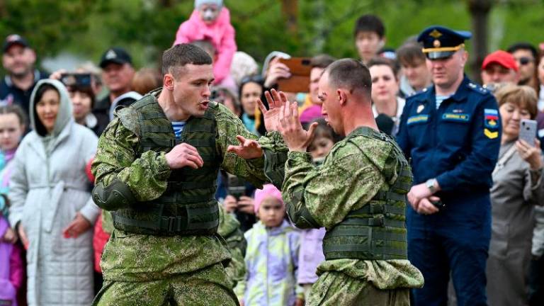 Cadets of the Omsk Tank Engineering Institute demonstrate their skills in a fight during a performance dedicated to the upcoming 80th anniversary of the victory over Nazi Germany in World War Two, in the Siberian city of Omsk, Russia, May 3, 2025. REUTERSpix