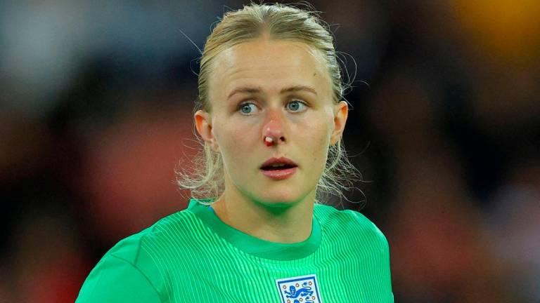 FILE PHOTO: England’s Hannah Hampton with blood on her nose- REUTERS