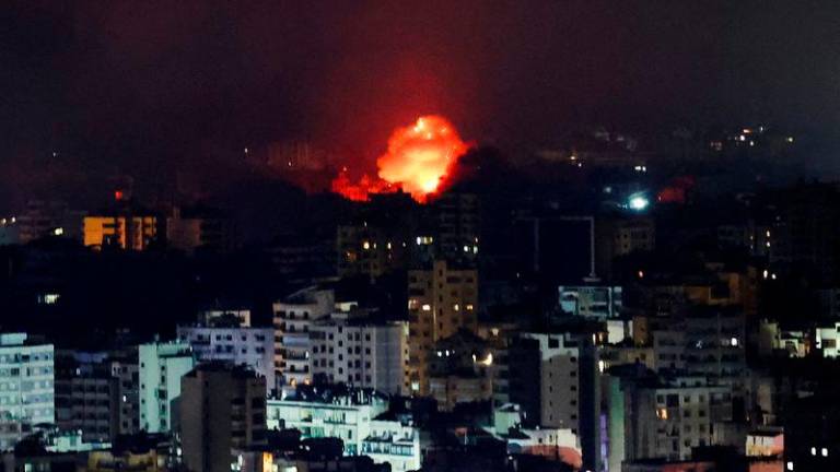 Fire and smoke rise over Beirut’s southern suburbs after a strike, amid ongoing hostilities between Hezbollah and Israeli forces, as seen from Sin El Fil - REUTERSpix