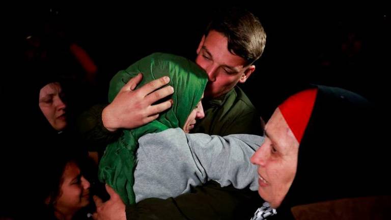 A freed Palestinian prisoner is greeted after being released from an Israeli jail as part of a hostages-prisoners swap and a ceasefire deal in Gaza between Hamas and Israel, in Ramallah - REUTERSpix