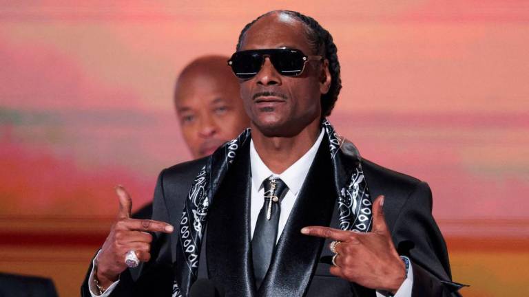 FILE PHOTO: Snoop Dogg gestures on stage at the 25th annual BET (Black Entertainment Television) Awards, in Los Angeles, California, U.S. June 9, 2025- REUTERS