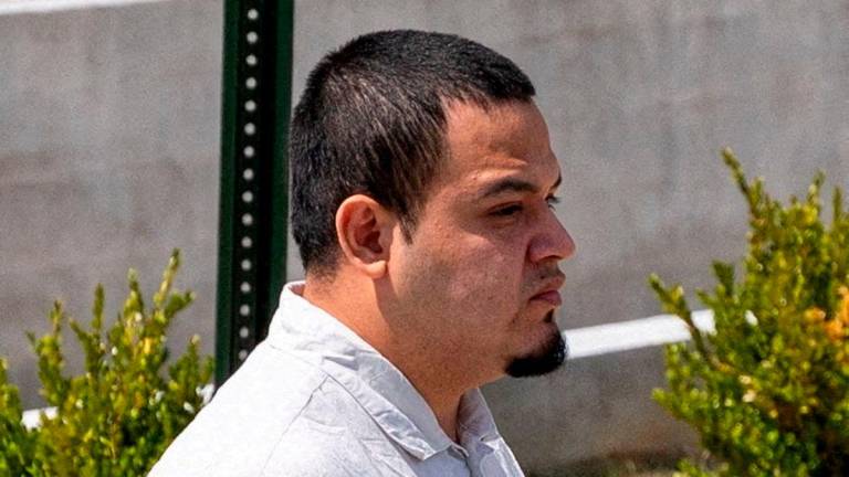 FILE PHOTO: Kilmar Abrego Garcia walks after he has been released from the Putnam County Jail in Cookeville, Tennessee, U.S., August 22, 2025. REUTERS/Seth Herald/File Photo